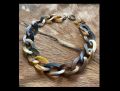 Handgemaakt buffelhoorn collier, bruintinten. Matte finish. Schakels hebben een twist. 65cm.